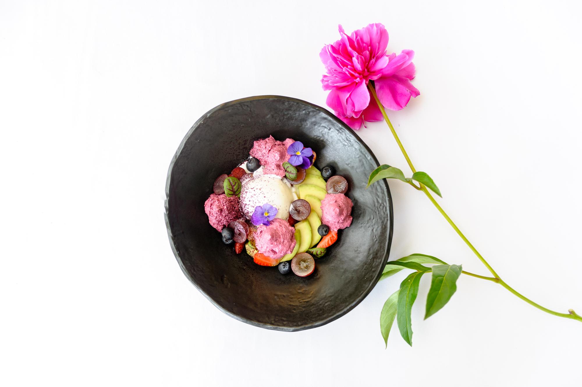 Plate with seasonal salad and edible flowers