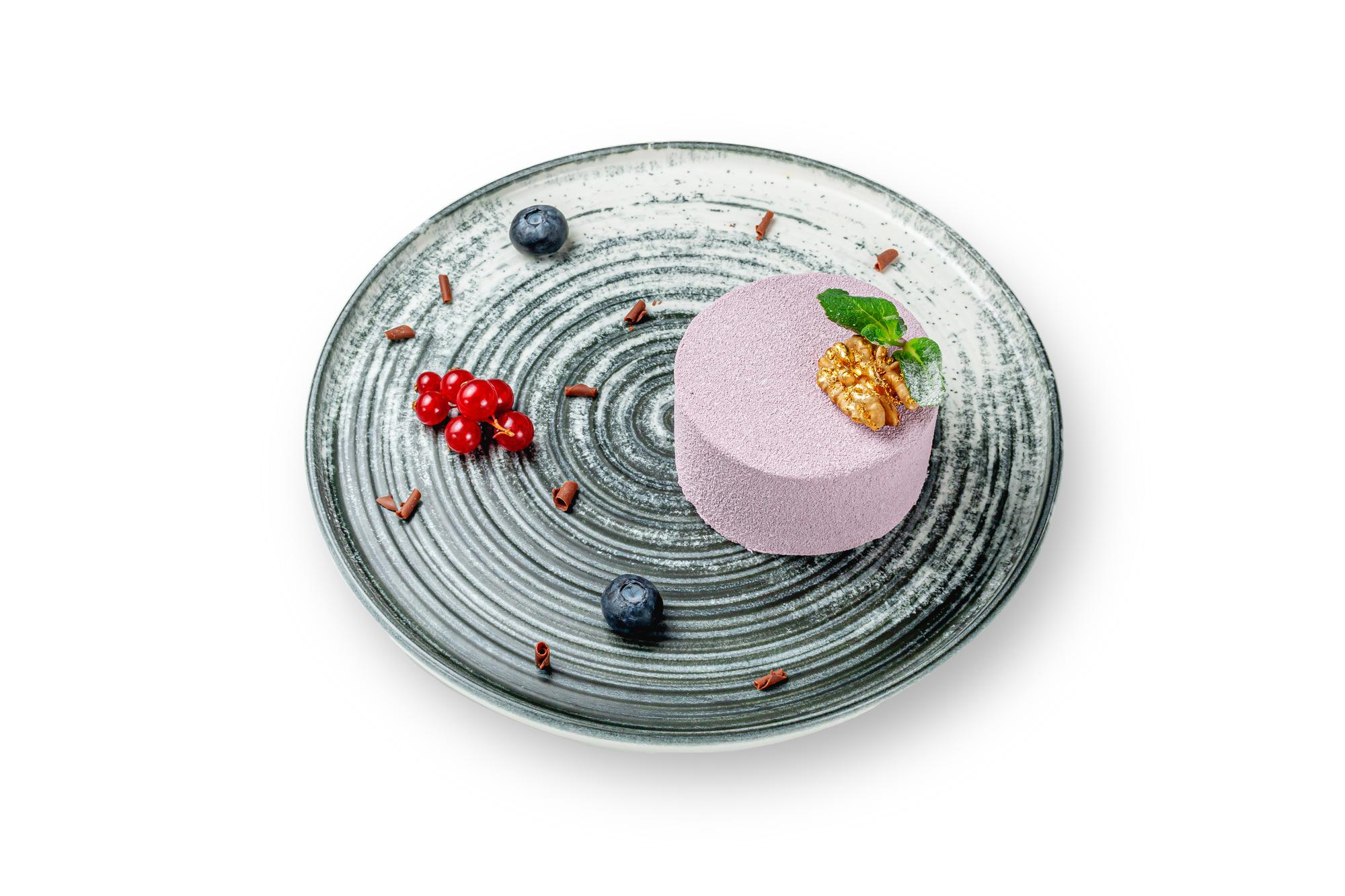 Artful dessert on ceramic plate