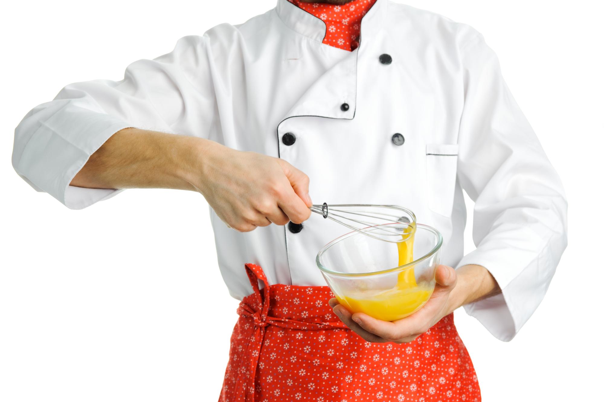 Chef mentor arranging a dessert